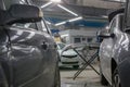 Cars are parked in a car repair shop`s garage Royalty Free Stock Photo