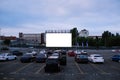 Cars parked in front of drive-in cinema screen