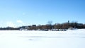 Cars parked on frozen Lake Bemidji near the University where students have a shorter walk to class.