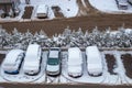 Cars parked near the house, covered with snow on a winter day, top view Royalty Free Stock Photo
