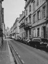 Cars parked in old street of Bordeaux, stock photo.