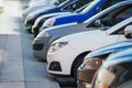 Cars parked in a row on a city street Royalty Free Stock Photo