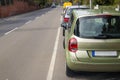 Cars parked on the side of a street in residential area Royalty Free Stock Photo