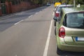 Cars parked on the side of a street in residential area Royalty Free Stock Photo