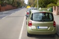 Cars parked on the side of a street in residential area Royalty Free Stock Photo