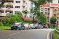 Cars parked on the sidelines in a row. Street in Malaysia