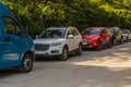 Cars in the parking lot along the street Royalty Free Stock Photo