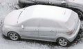 Cars in the parking lot covered in sticky snow