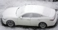 Cars in the parking lot covered in sticky snow