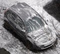 Cars in the parking lot covered in sticky snow