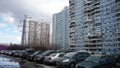 Cars in the Parking lot and high-rise residential buildings in winter Moscow
