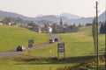 Cars pass by a countryside road, Affoltern im Emmental, Switzerland.