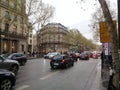 Cars, people and buildings on the famous Boulevard des Capucines in the city of Paris Royalty Free Stock Photo