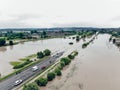 Cars and people cannot cross a flooded road. Aerial view of the flooded road, streets and houses in the village