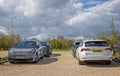 Cars recharging at the electric car recharging points in the car park at The Newt, Somerset, UK