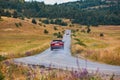 Cars riding on smooth road. Nature landscape and green forest. New adventure and travel. New way and future concept Royalty Free Stock Photo