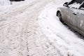 Cars on the road in snowdrifts. Snow drifts on the road after a snowfall