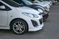 Cars in row in front of car parking Royalty Free Stock Photo