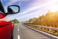 Cars running on the road in the sunlight