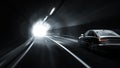 Cars rush in a dark tunnel towards the light. Royalty Free Stock Photo