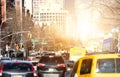 Cars in rush hour traffic along 1st Avenue in Manhattan New York City with sunlight shining between the background Royalty Free Stock Photo