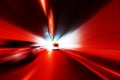 Cars rush through the tunnel in the beams of searchlights. Royalty Free Stock Photo