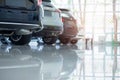 Cars For Sale. Automotive Industry. Cars Dealership Parking Lot. Rows of Brand New Vehicles Awaiting New Owners in the showroom Royalty Free Stock Photo