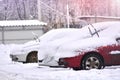 Cars in snow on a parking lot