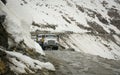 Cars on the snow road in Khardungla, India Royalty Free Stock Photo