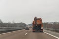 Cars and special purpose vehicle for wet waste disposal on an autobahn, Germany Royalty Free Stock Photo