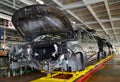 Cars stand on the conveyor line of assembly shop. Automobile plant