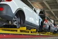 Cars stand on the conveyor line of assembly shop. Automobile pro