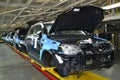 Cars stand on the conveyor line of assembly shop. Automobile production