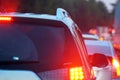 Cars stand in a row in a traffic jam