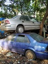 Cars standing one over another after a road accident. Pile of cars in a police station.