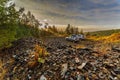 Cars standing in a quarry at dawn. Royalty Free Stock Photo