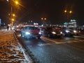 Cars stopped at a traffic light at a pedestrian crossing to highways in the night city in winter January 20, 2020 in Russia, Kazan Royalty Free Stock Photo