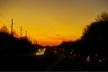 Cars stuck in traffic at dramatic sundown time