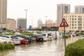 DUBAI, UAE - CIRCA 2020: Cars stuck in water in a flooded parking lot after heavy in rain in Dubai