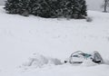 Cars submerged in snow after the snowstorm