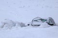 Cars submerged in snow after the snowstorm in the mountains