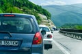 Cars  on a  Sunny mountain road Royalty Free Stock Photo