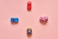 Cars toys on pink background.