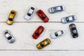 Cars toys on white wooden background. Top view Royalty Free Stock Photo