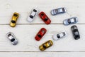 Cars toys on white wooden background. Top view Royalty Free Stock Photo