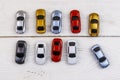 Cars toys on white wooden background. Top view Royalty Free Stock Photo