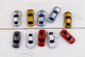 Cars toys on white wooden background. Top view Royalty Free Stock Photo