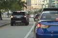 Cars traffic driving on American street with traffic lights in Miami, Florida. USA transportation Royalty Free Stock Photo