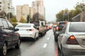 Traffic jam on a city street on wet road after rain Royalty Free Stock Photo