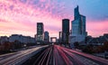 Cars trails and moves in to and out from La Defense, business district night, Paris